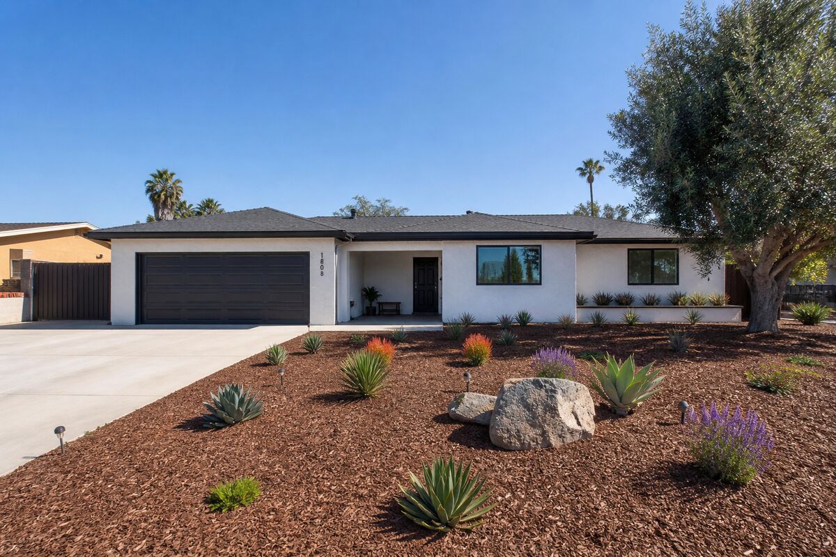 Exterior of a remodeled single-story ranch home with drought-tolerant landscaping